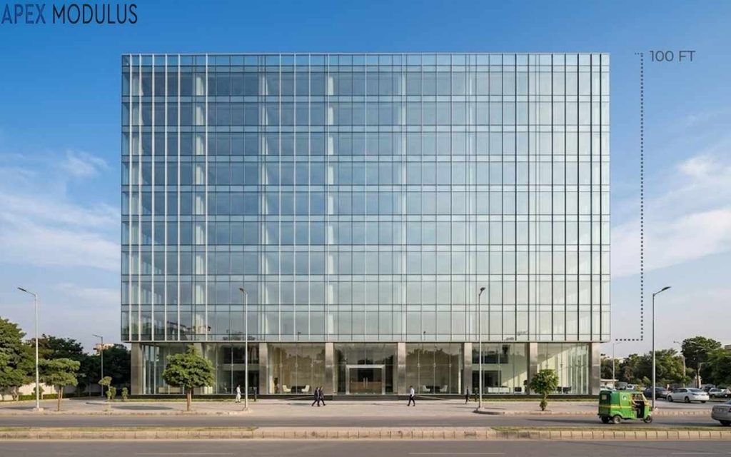 A modern, ten-story glass office building photographed straight-on from across a street under a clear blue sky.